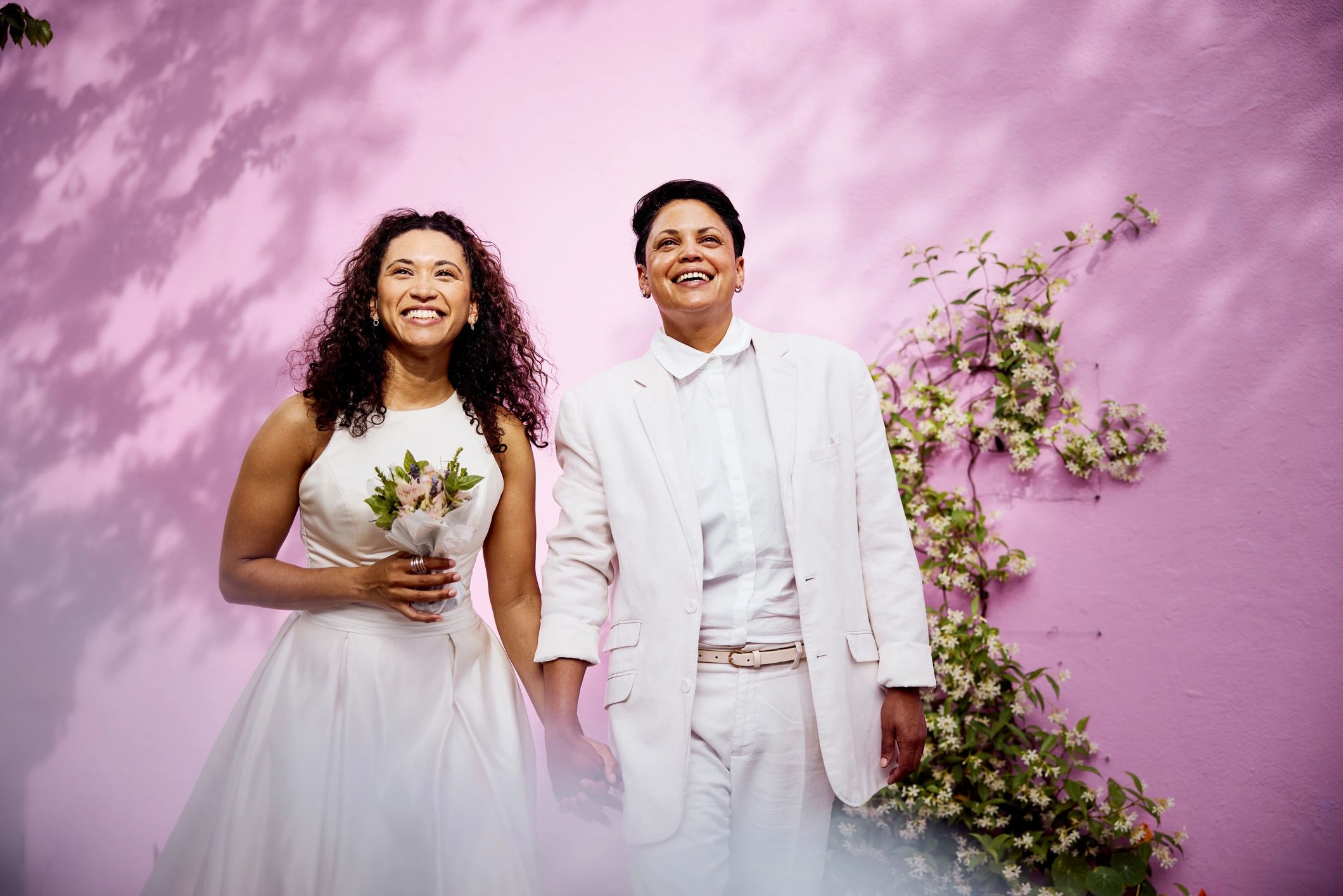 Couple in wedding attire standing together